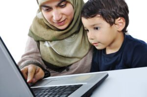 Muslim-woman-and-her-son-on-laptop